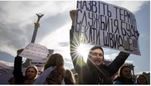 Voices of Longing: Wives of Deployed Soldiers Plead for Reunion at Putin's Campaign HQ